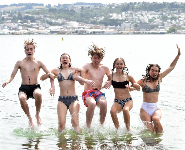 Cooling down at Vauxhall from left, Jack Murphy (16) Niamh Crooks (15) Sam Sinclair (15) Sophie Broadley (16) and Elsha Bulmer (16) all of Dunedin on a hot Dunedin day at Macandrew Bay on Tuesday evening.PHOTO:PETER MCINTOSH