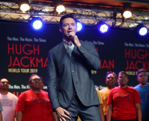 Hugh Jackman performs with students from AUT's South Campus in Auckland this morning. Photo:...