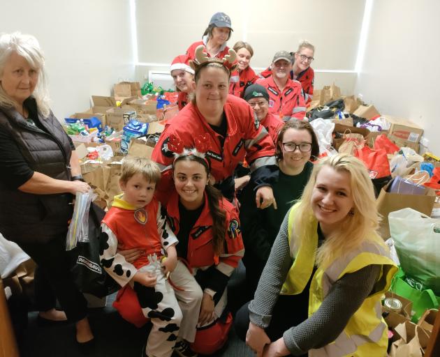 Volunteers celebrate the record haul at Kaiapoi Community Support. PHOTO: DAVID HILL
