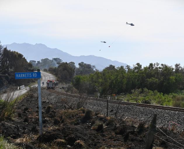Helicopters work north of Kaikoura in the Beach Rd, Harnetts Rd area. Photo: Biddy Getz