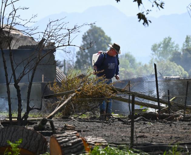 Hard at work extinguishing hot spots at the Harnett property north of Kaikoura. Photo: Biddy Getz