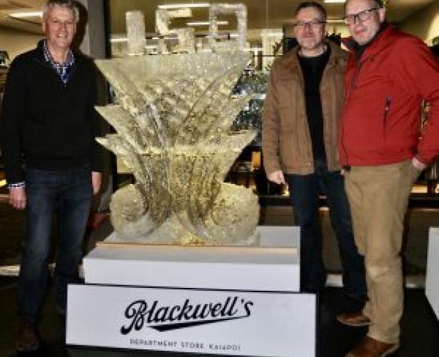 Andrew Blackwell, left, Greg Comfort and Maarten Loeffen beside the finished tribute. Photo:...