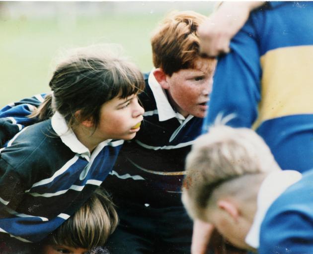 A young Celeste Donovan prepares to pack down in a scrum for a junior team in Sumner. Photo:...