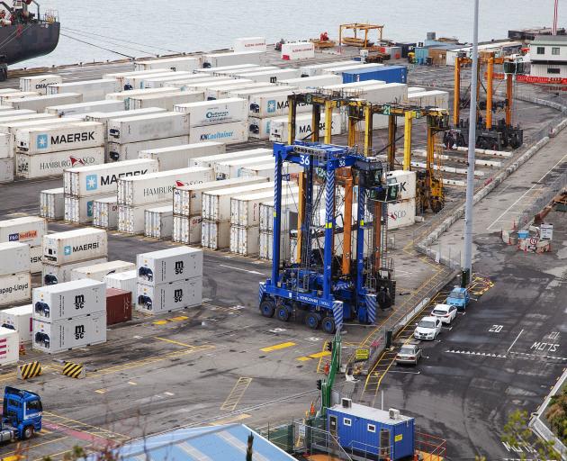 Straddle carriers at work among the containers. Photo: Star Media