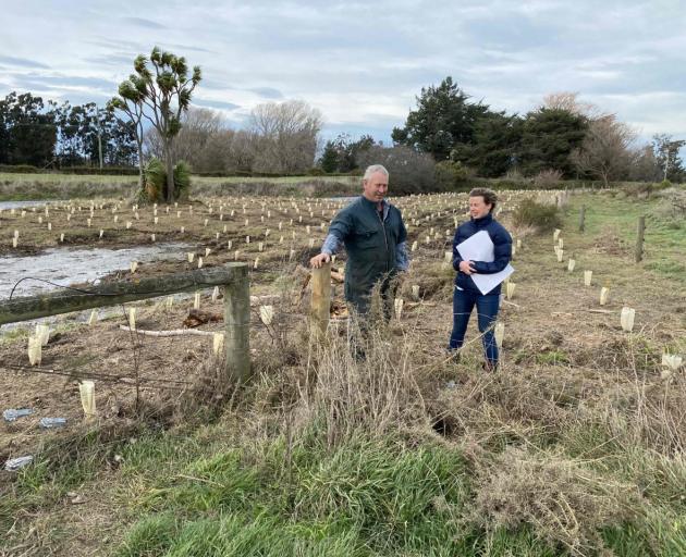 Project Tinaku co-ordinator Johanna Blakely and farmer Geoff Heslop discuss a planting project...