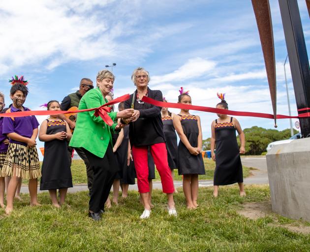 Mayor Lianne Dalziel and Aileen Trist cut the ribbon at the unveiling of the Anzac Fronds. Photo:...