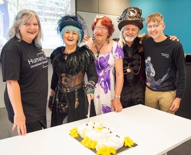 Sarah Mankelow (left), along with Yvonne, Patricia, Carl and Neith, cut the cake on the opening...