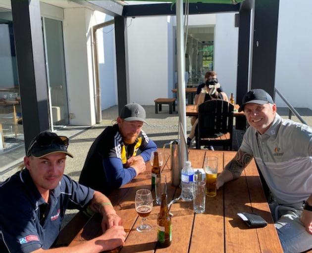 The three golfers (from left) Cody Elvy, Seamus Smyth and Christian Cullen, enjoy a drink...