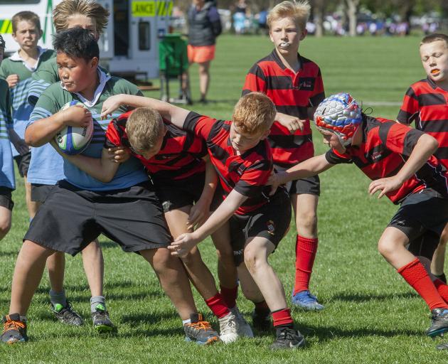 Westburn player Toni Ielua proves hard to stop. 