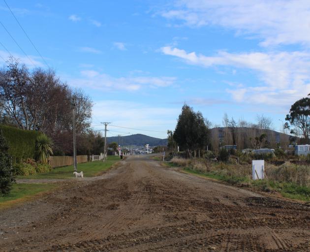 Palmerston St, in Riverton, is dusty in summer and muddy in winter, a resident says.