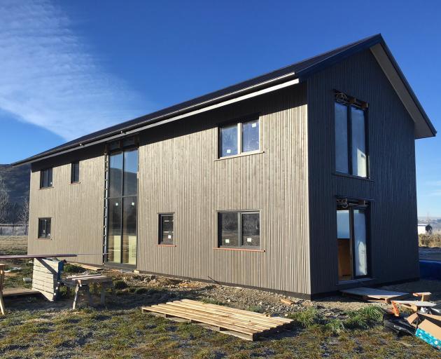 The house is built with structural insulated panels and clad with Siberian larch. PHOTOS:...