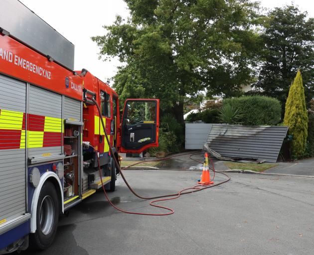 Firefighters at the house fire in Bishopdale. Photo: Geoff Sloan