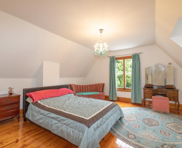 The upstairs bedrooms have dormer windows and wide Baltic pine floorboards. 