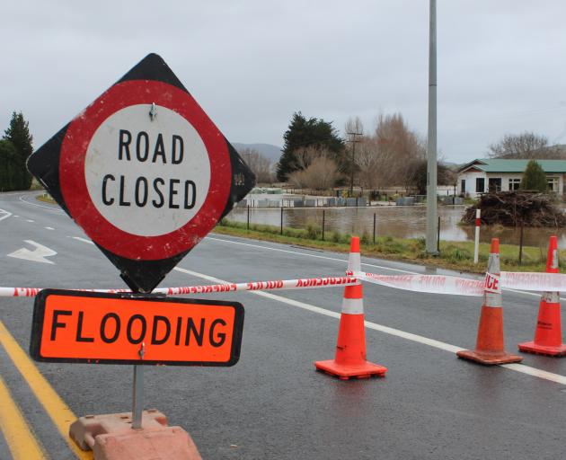 The SH1 and SH8 intersection south of Milton where the Tokomairaro River has flooded. Photo:...