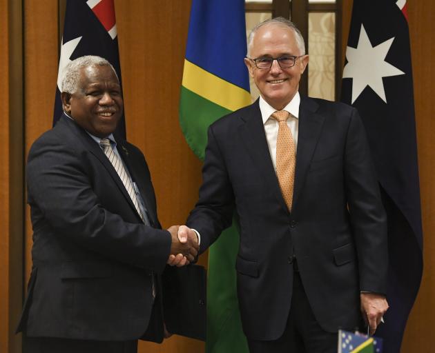Prime Minister of the Solomon Islands Rick Houenipwela (left) and Australian Prime Minister...