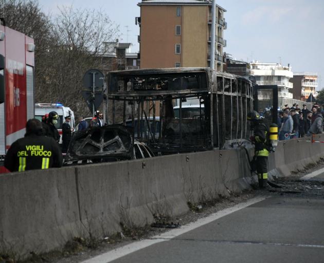 Police managed to get all passengers out safely after the bus was set on fire. Photo: AP