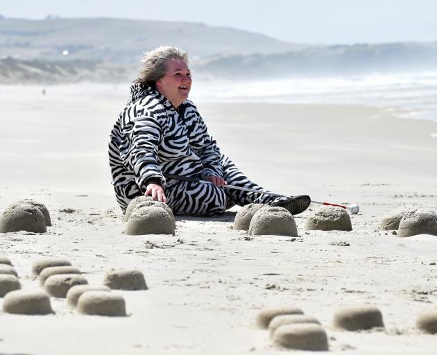 Blind Foundation ambassador Julie Woods at Middle Beach. Photo: Peter McIntosh