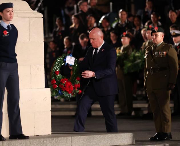 New Zealand Prime Minister Christopher Luxon lays a wreath at a dawn service held in Auckland...