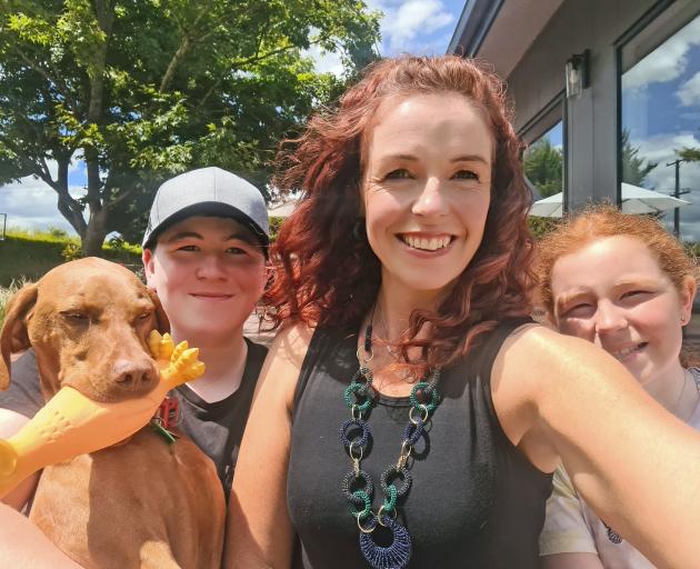 Owner Maria Porter with children Brady (14) and Alice (10) and their Hungarian vizsla, Willow....