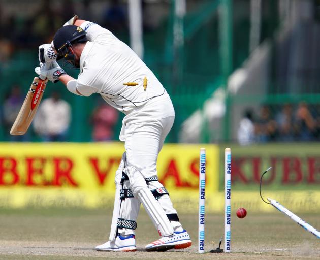 New Zealand's Mark Craig is bowled by India's Mohammed Shami. during the first test match at...