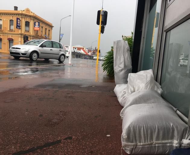 Sandbags outside a storefront in Mosgiel. Photo: Christine O'Connor