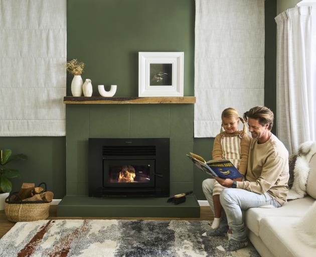 Wall, tiles and hearth painted in Resene Cabbage Pont, mantelpiece finished in Resene Colorwood...