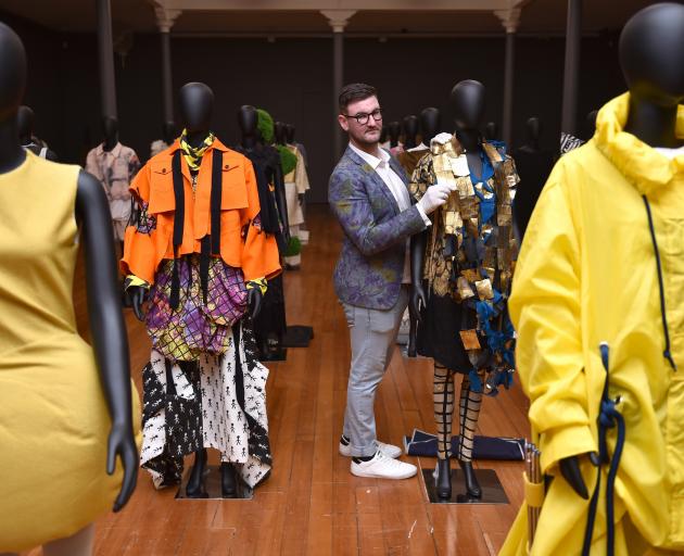 Otago Museum curator Craig Scott puts some finishing touches on the ‘‘Fashion FWD’’ exhibits....