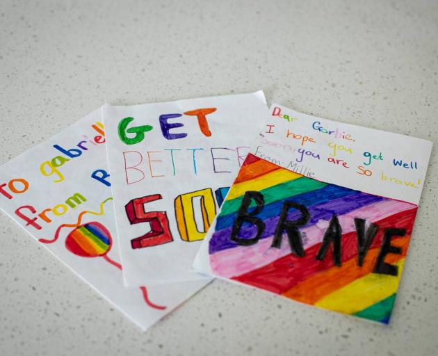 Glenn Muirhead's children made Gabriele Mellar cards after their dad saved her from drowning in...