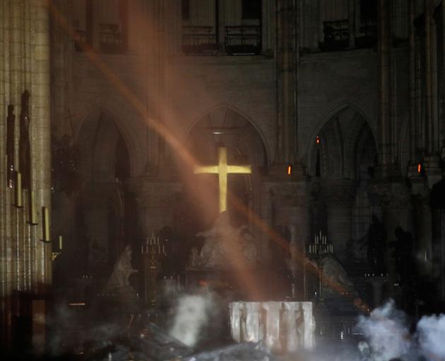 Philippe Wojazer's eerie image was captured down one of Notre-Dame's two naves to a raised golden...