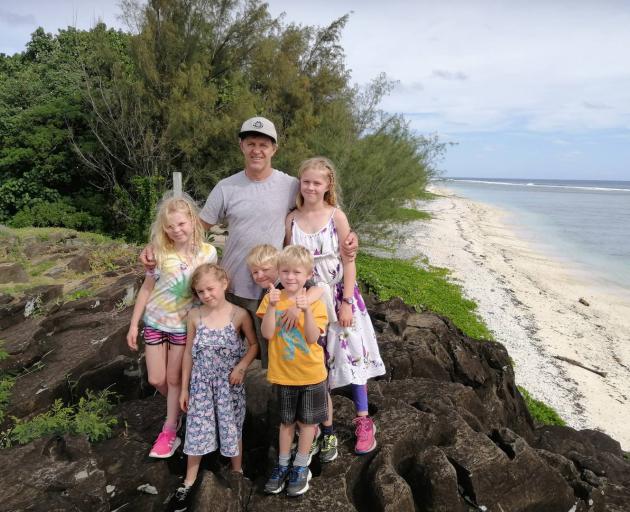 Glenn Muirhead was with his children on the beach in Rarotonga when he heard someone calling for...