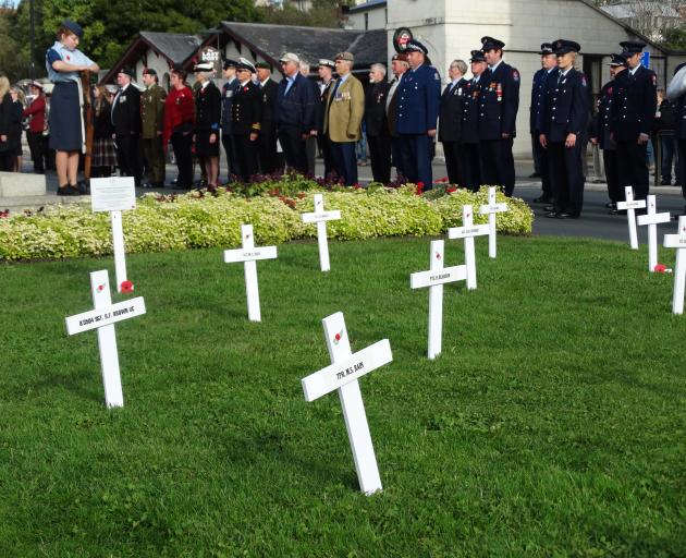 A parade in lower Thames St stops to pay its respects at Oamaru's World War One memorial. PHOTO:...