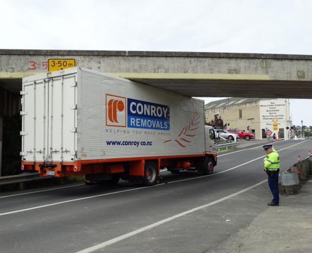 The truck became wedged about 10.15am today. Photo: Daniel Birchfield 