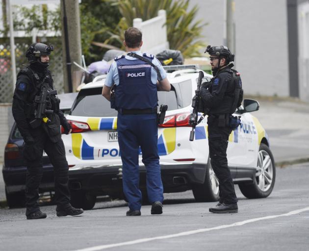Heavily armed police outside a property in Carroll St this afternoon. PHOTO: GERARD O'BRIEN