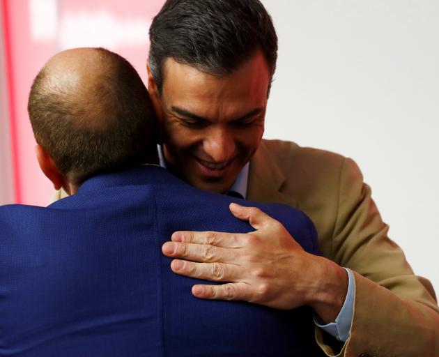 Spain's acting Prime Minister Pedro Sanchez is congratulated on victory at the polls. Photo:...