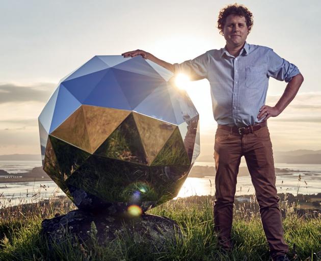 Rocket Lab founder Peter Beck with 'Humanity Star', New Zealand's first satellite. Photo: supplied