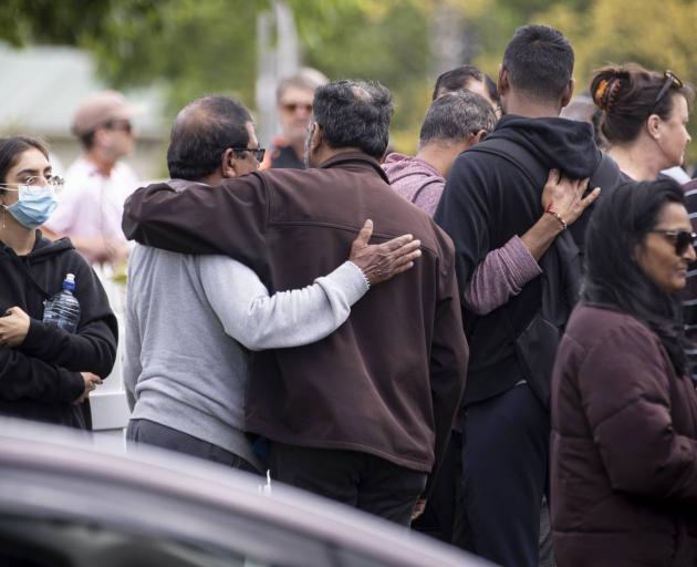 Hundreds gathered outside the Rose Cottage Superette in Sandringham to pay tribute to the slain...