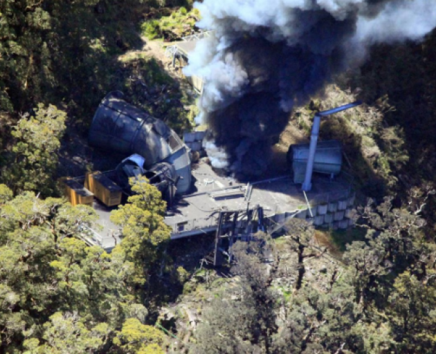 Smoke billows from the ventilation shaft after the fourth explosion in the Pike River coal mine...