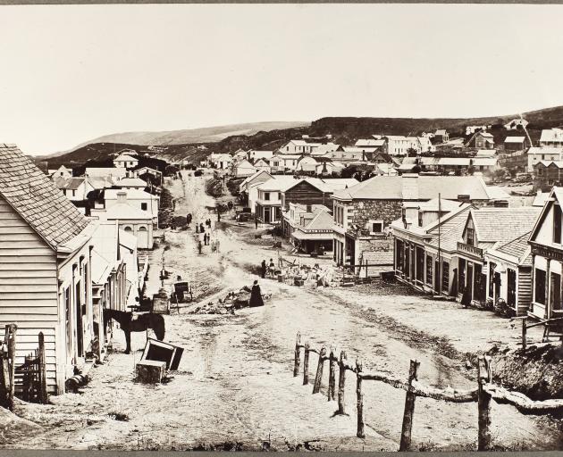 Princes St, Dunedin in 1860. By this time the centres of Pakeha towns were beginning to change....