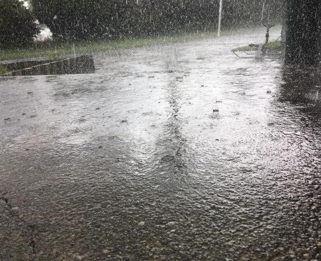 Rain was falling heavily in Omakau on Thursday afternoon. Photo: Alexia Johnston