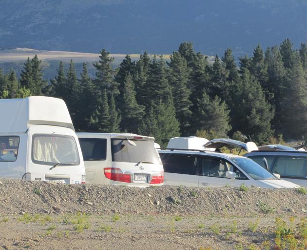A line-up of camper vans at the Red Bridge ``hub'' near Luggate. PHOTO: MARK PRICE