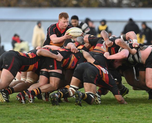 Zingari-Richmond's Lachlan Collins frees the ball from the scrum in today's premier rugby match...