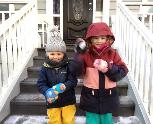 Harry (3) and Ada Christie (5) in Maryhill, Dunedin this morning rugged up to the hilt for kindy and school on a snowy Tuesday morning. Photo: Christine O'Connor