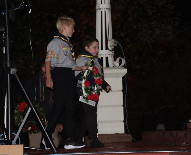 1st Gore Scout Group members Willem Meijers (front, 11) and William McDowell (8) present their...