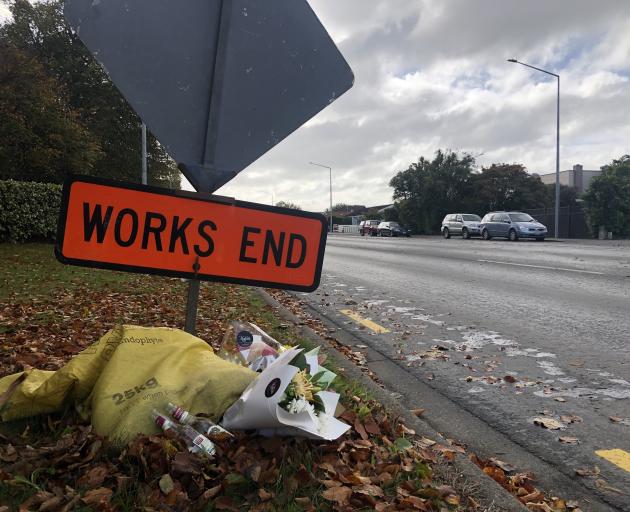 Makeshift memorials, including flowers, bottles of cider and a softball have been left at the...