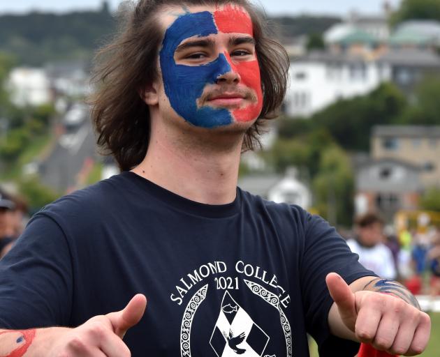 Salmond College resident Jack Elliott (19) shows support for his college.