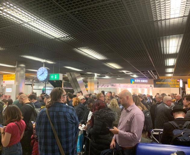 Passengers waiting in Schipol Airport during the security alert. Photo: Mark Crompton via Reuters 