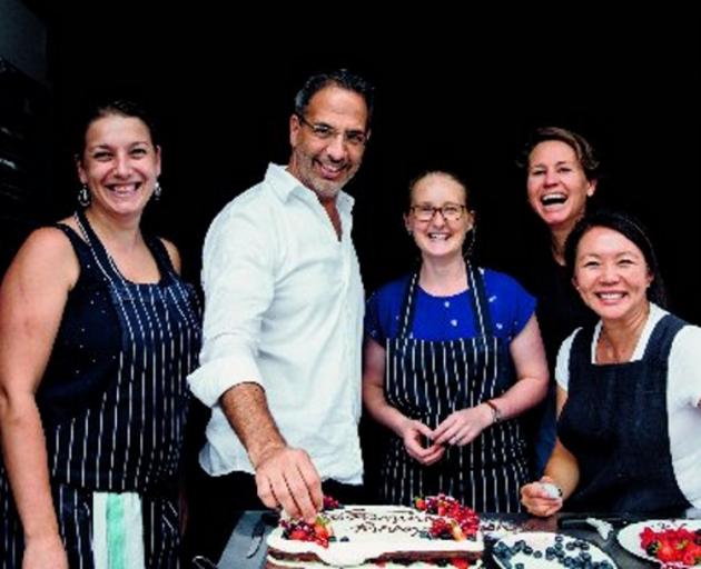 Yotam Ottolenghi with his team of recipe writers, testers and tasters. Photo: Jonathan Lovekin