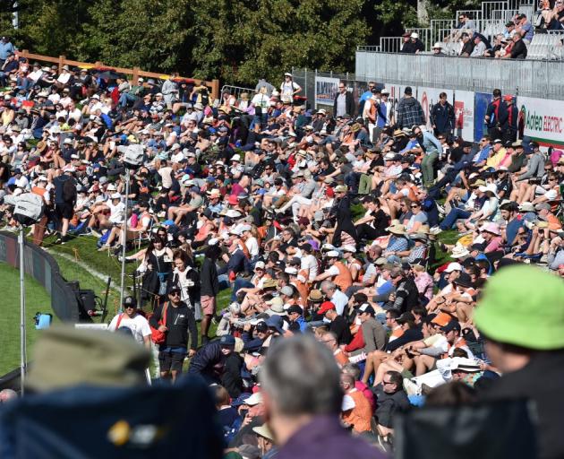 A good crowd turned out to watch the thrilling match at the University Oval. Photo: Peter McIntosh