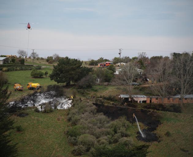 Helicopters fight a fire at Glen Warren Reserve, Oamaru. PHOTOS: REBECCA RYAN/LAURA SMITH...