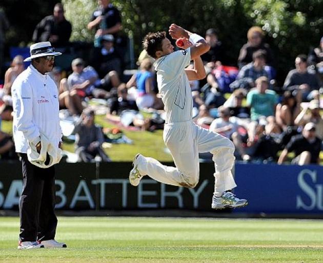New Zealand bowler Trent Boult steams in. photo by Peter McIntosh